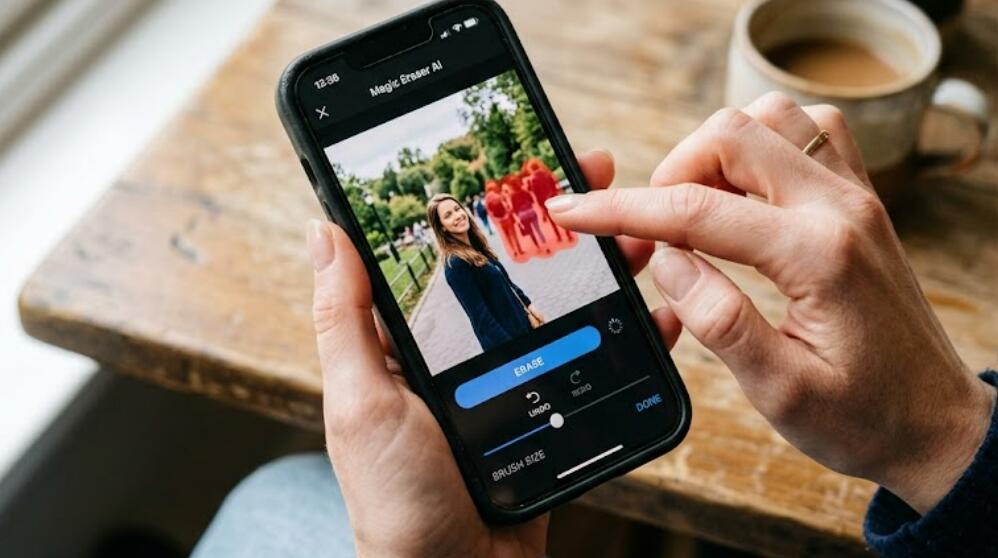 A lady was removing unwanted people from a photo with an AI app